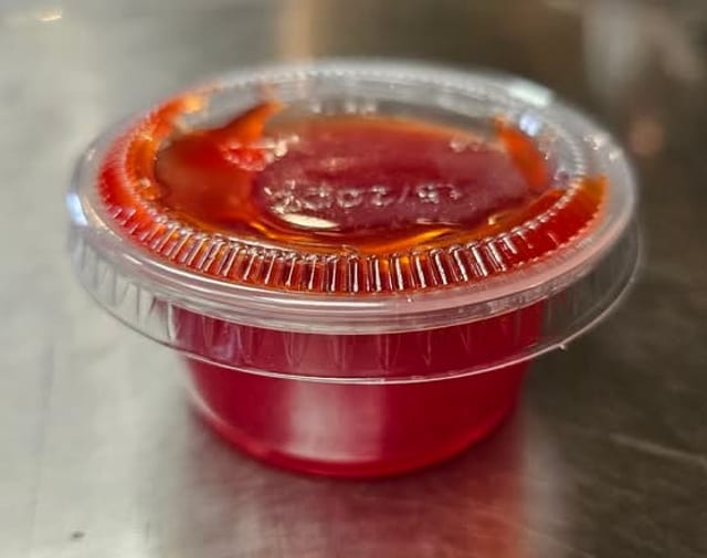 Cup Of Sweet & Sour Sauce.